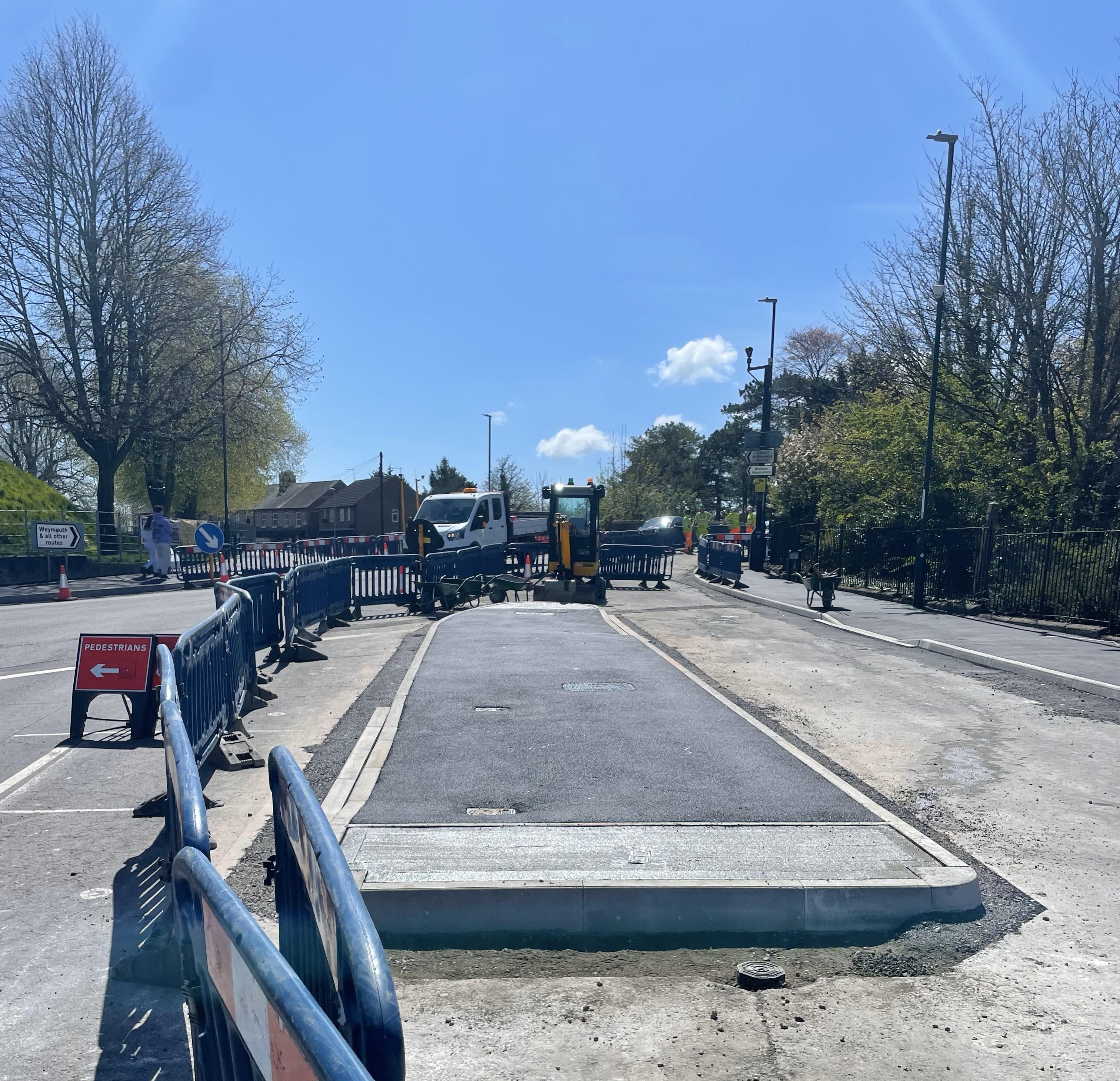 A raised island in the centre of a road under construction