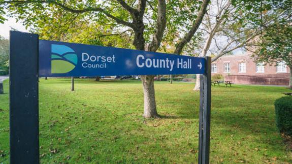 An image of a sign that says Dorset Council, County Hall