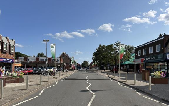 An artist impression of a high street with bollards, planters and flagpoles either side
