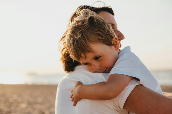 Parent and child hugging
