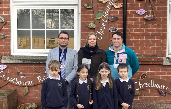 Cheselbourne Village School headteacher Chris Perry, Councillor Clare Sutton, Cabinet Member for Children's Services and Jon Möller, chair of governors with pupils